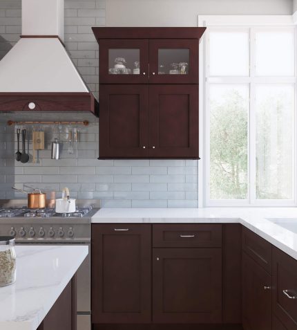 A kitchen featuring a stove, oven, sink, and cabinets, showcasing a functional and organized cooking space.