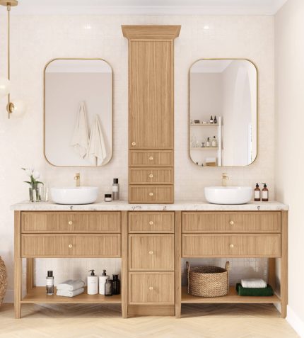 A bathroom featuring two sinks and a large mirror above them, with neutral-colored walls and modern fixtures.